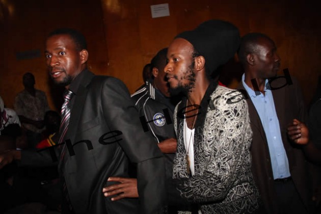 Winky D had to be shielded after an angry young man threw a can at him
