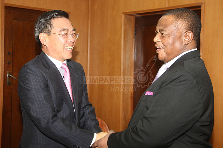 Vice President General Constantino Chiwenga (Rtd) (right) welcomes Chinese Ambassador to Zimbabwe Mr Huang Ping at his Munhumutapa offices in Harare today. Picture by Justin Mutenda