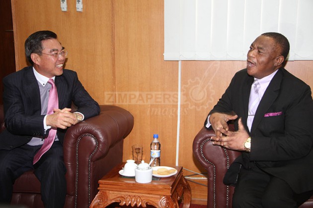 Vice President General Constantino Chiwenga (Rtd) (right) chats with Chinese Ambassador to Zimbabwe Mr Huang Ping at his Munhumutapa offices in Harare yesterday. Picture by Justin Mutenda