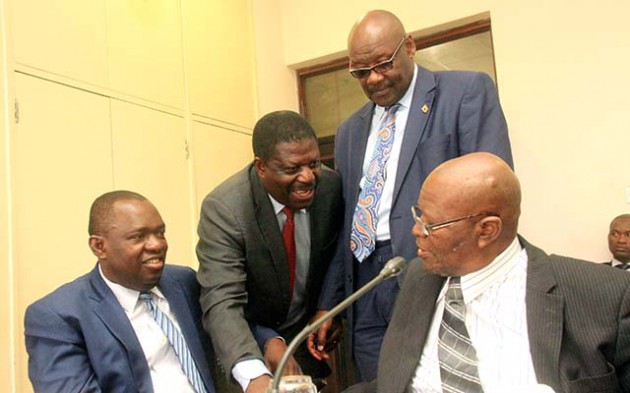 ZANU PF Politburo members Cde's Sibusiso Moyo,Mike Bimha, Dr Parirenyatwa and Joshua Malinga before a Politburo meeting at the party headquarters in Harare yesterday.-Picture by Munyaradzi Chamalimba