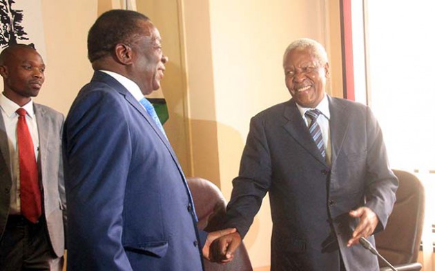 President Emmerson Mnangagwa shares a lighter moment with Cde Sydney Sekeramai at a Poilitburo meeting held ta the ZANU PF headquarters in Harare yesterday.-Picture by Munyaradzi Chamalimba