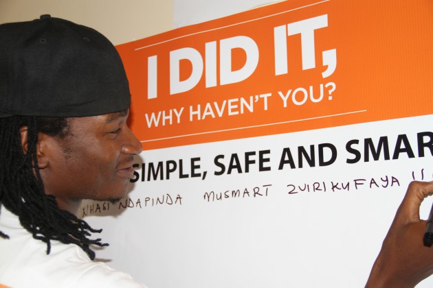 Jah Prayzah writes on a board at the Circumcision Centre. (All Pictures by Innocent Makawa)