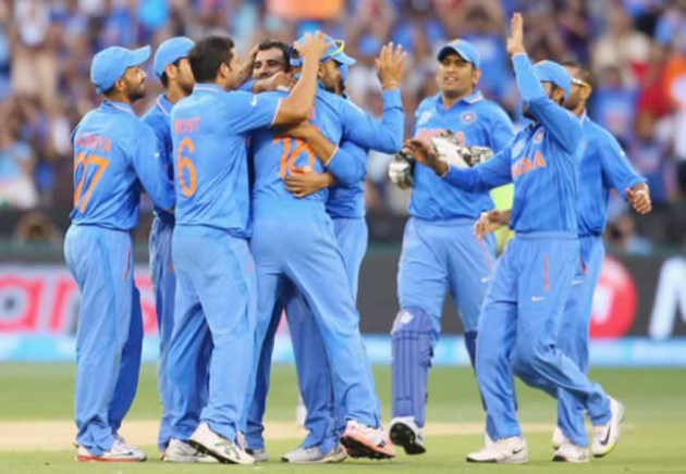 The Indian team celebrates the fall of a South African wicket in Melbourne, Australia