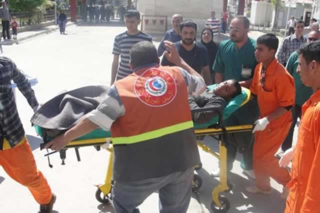 A man is taken to a hospital on a stretcher after after being wounded in the clashes.