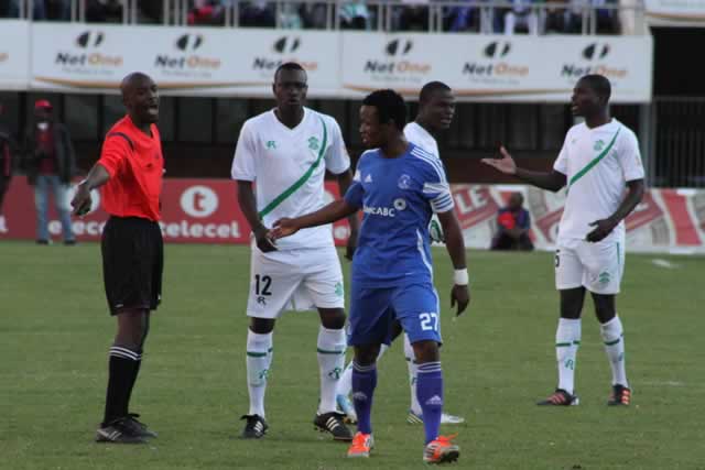 Referee Darlington Shonhiwa orders Dynamos centre-back Partson Jaure not to leave