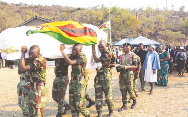 Zimbabwe National Army 3 Infantry Brigade pallbearers carry the casket bearing the body of Provincial Hero Cde Joseph Michael Nyakatawa, who was buried at the Manicaland Provincial Heroes Acre yesterday. — (Picture by Tinai Nyadzayo)
