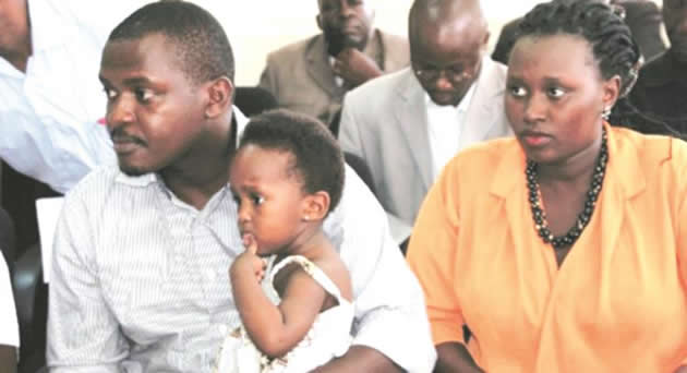 Eric Kamanzi, his wife, Angela, and baby Arnella at the police headquarters. — The Monitor