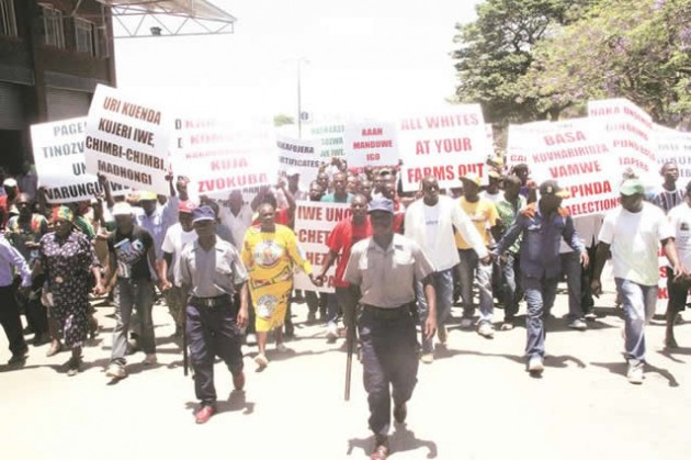 zanu-pf supporters demonstrate against Mashonaland East provincial chairman Cde Ray Kaukonde and his executive in Marondera before passing a vote of no confidence in him yesterday. — (Picture by Innocent Makawa)