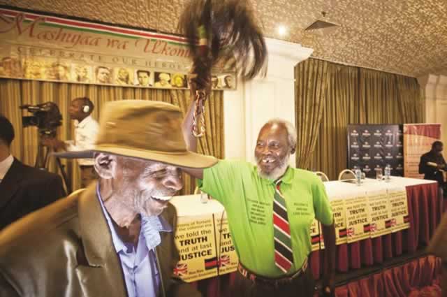 In this file picture, Mau-Mau veteran Mathenge Iregi (81) waves a ceremonial whisk to celebrate as he and others win their case against Britain. About 5 200 Kenyans wait to get paid by Britain for colonial-era acts of torture. — AP