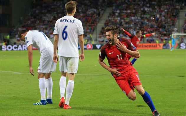 Liverpool midfielder Adam Lallana wheels away after his dramatic late goal at the City Arena gave England the three points yesterday. — DailyMail