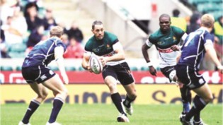 FOR MY COUNTRY . . . Cheetahs’ ace Jacque Leitao tries to find a way past a defensive wall during the last Hong Kong Sevens. — IRB