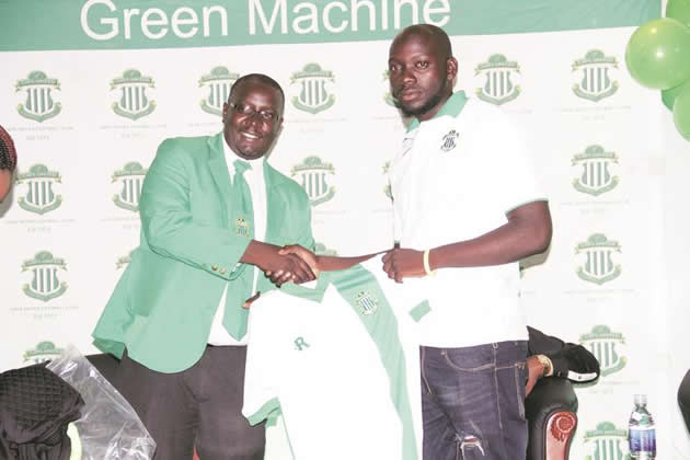 GOOD TIMES ROLLING . . . CAPS United chairman Lewis Uriri (left) and goalkeeper Edmore Sibanda display their new kit at yesterday’s function in Harare