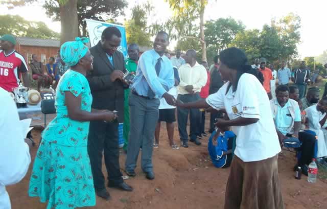 Local leaders and Datco Group officials congratulating winners of the Muzarabani district sports tournament