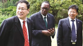 Minister Joseph Made is flanked by General Director Chinese Foreign Economic Co-operation Centre  Mr Yang Yi (left) and Han Bing from Chinese Embassy after a meeting in Harare yesterday