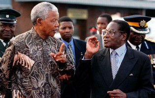 The late former South African President Nelson Mandela and his Excellency President Robert Mugabe