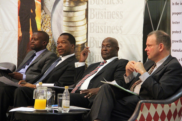 From left to right: CZI Manicaland chamber president Mr Richard Chiwandire, RBZ governor Dr John Mangudya, Bankers Association of Zimbabwe president Mr Sam Malaba and World Bank senior country economist Dr Johannes Herderschee follow proceedings during a business symposium organised by The Herald Business and the CZI yesterday. — (Picture by Kudakwashe Hunda)