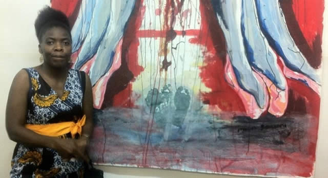 Mavis Tauzeni with one of her paintings