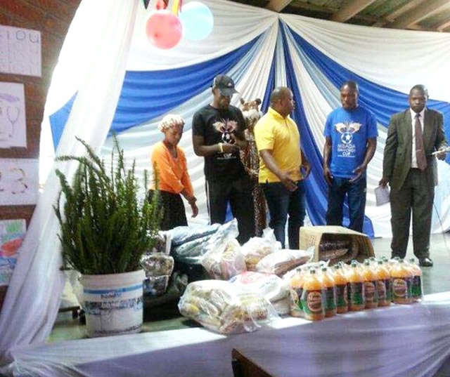 CHRISTMAS CHEER . . . Highlanders and How Mine players yesterday visited Tembisa Children’s Home and Emphandeni Old People’s Home and donated goodies as part of Mbada Diamonds’ social responsibility programmes ahead of today’s Mbada Diamonds Cup Final