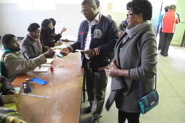 MDC president Welshman Ncube and wife Thobekile go through the voting process at Stanely Hall in Makokoba Bulawayo at 1015am.