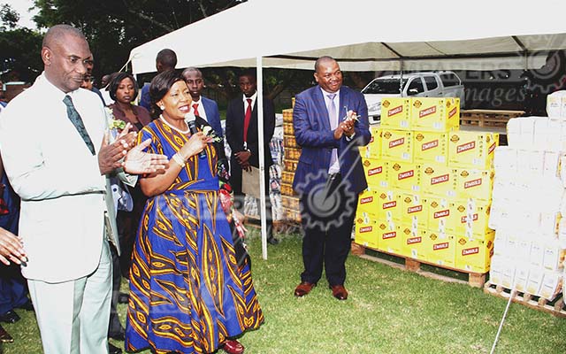 First Lady Auxillia Mnangagwa donating foodstuffs during her tour at Gweru Provincial Hospital yesterday. Looking on are Minister for Midlands Provincial Affairs Owen Ncube and the Hospital's medical Superintendent Dr Fabian Mashingaidze. Picture by John Manzongo