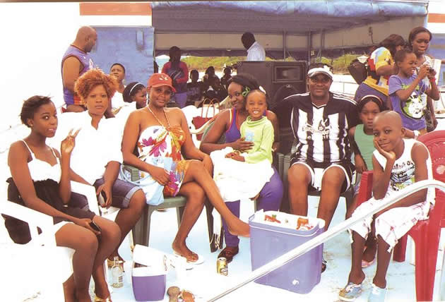 FAMILY AFFAIR . . . Zimbabwe National Soccer Supporters Association life president Nyatanga and his family enjoy a boat cruise with the Sharuko family including the late Mimi (fourth from left) in Kariba