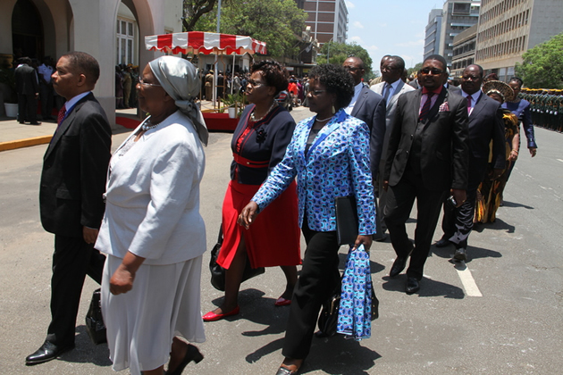 Members of Parliament walked side-by-side as they entered the House for the official opening of the Second Session of the Eighth Parliament on Tuesday