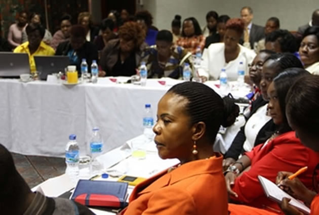 National Assembly members sit on the floor in the august house in protest against the abuse of Zimbabwean women in Kuwait. — (Picture by Tawanda Mudimu)