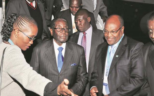 President Mugabe is welcomed at Sir Seretse Khama International Airport in Gaborone, Botswana, last night by that country’s Finance and Development Planning Minister Dr Kenneth Matambo and senior Foreign Affairs official Miss Daphne Mlotshwa. Also present was Zimbabwe’s Ambassador to Botswana Thomas Mandigora. — (Picture by Presidential Photographer Joseph Nyadzayo)