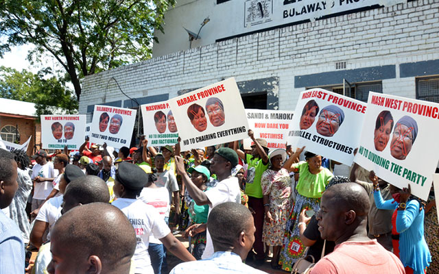Zanu-pf Women's League members demonstrate against their deputy chairperson Cde Eunice Sandi Moyo and treasurer Cde Sarah Mahoka at Davies Hall in Bulawayo yesterday