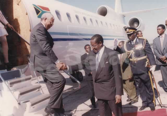 President Mugabe welcoming the late Cde Nelson Mandela on arrival at the Harare International Airport in May 1997.