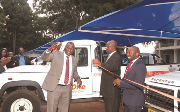 Information Communication Technology, Postal and Courier Services Minister Supa Mandiwanzira cuts the ribbon, while NetOne board chairman Peter Chingoka (centre) and Chief operating officer Clever Isaya, look on during the commissioning of NetOne‘s fleet of cars in Harare yesterday. — (Picture by Memory Mangombe)