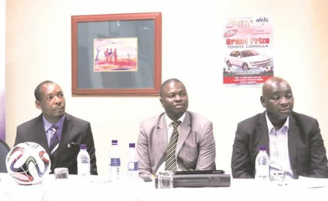 FOR THE FANS . . . World Navi Zimbabwe managing director Stanley Makombe (left), Zifa Northern Region vice-chairman Martin Kweza (centre) and chairman Willard Manyengavana follow proceedings at the launch of the sale of raffle tickets in Harare yesterday