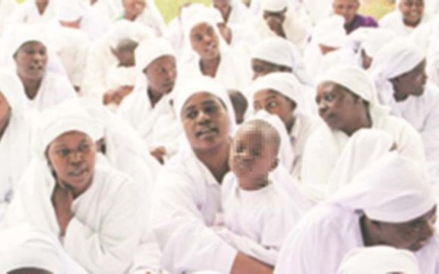 Members of the Johane Marange Apostolic Church can easily be identified by their white robes, men with shaved heads and women with white veils or doeks and worshipping in open spaces