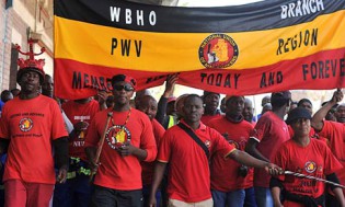 Members of the National Union of Mineworkers take part in a strike in Johannesburg. - STRINGER/Reuters