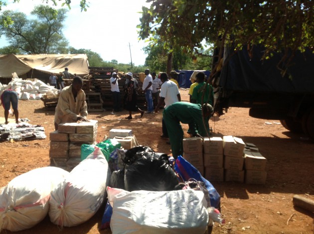 Men offload goods donated by readers of Zimpapers publications