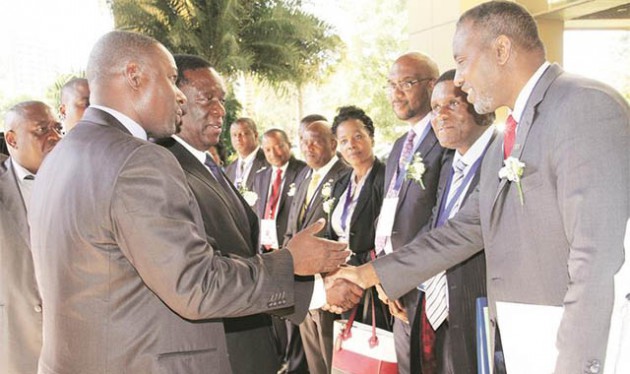 Vice President Emmerson Mnangagwa is introduced to Universal Postal Union director-general Bishar Hussein by Information Communication Technology, Postal and Courier Services Minister Supa Mandiwanzira while other delegates look on at the SADC Ministers for Postal and Courier Services meeting in Harare yesterday. — (Picture by Tawanda Mudimu)