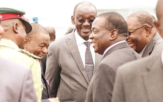 President Mnangagwa converses with Vice Presidents General Constantino Chiwenga (Retired) and Kembo Mohadi on his arrival at Robert Gabriel Mugabe International Airport in Harare yesterday from the 30th Ordinary Session of the African Union Assembly. Looking on are Zimbabwe Defence Forces Commander Phillip Valerio Sibanda and Home Affairs Minister Obert Mpofu. — (Picture by Believe Nyakudjara)
