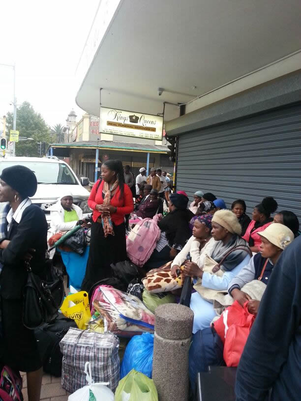 Some of the family members of the deceased waiting for transportation in Johannesburg