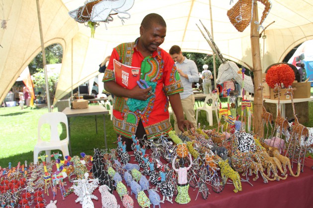 Mr Joseph Padzareverwa arranging his artwork at HIFA yesterday