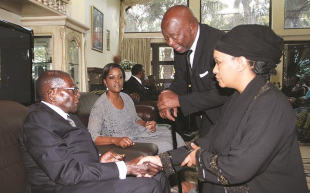 President Mugabe and First Lady Dr Grace Mugabe console national hero Godfrey Chidyausiku’s widow Farai while Ambassador Boniface Chidyausiku looks on at the family home in Harare yesterday. - Picture by John Manzongo