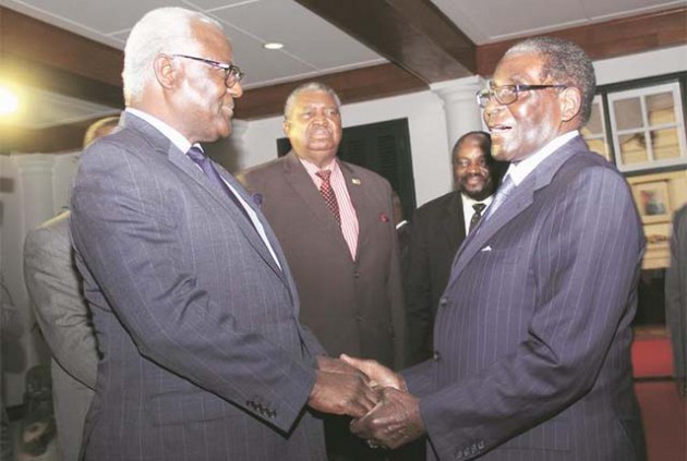 President Mugabe welcomes Sierra Leone President Dr Ernest Bai Koroma at State House in Harare yesterday. The Sierra Leone leader is consulting on United Nations Security Council reforms. Looking on are Vice President Phelekezela Mphoko and Foreign Affairs Minister Simbarashe Mumbengegwi