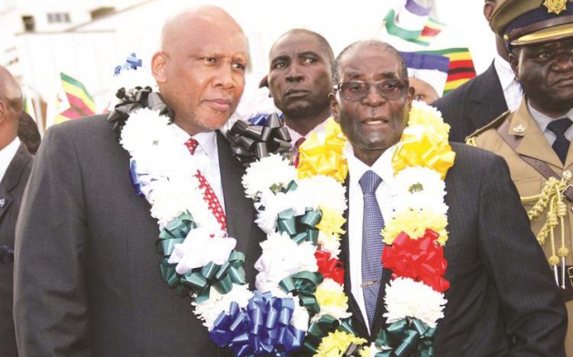 First Lady and zanu-pf Women’s League secretary Dr Grace Mugabe, flanked by Acting Manicaland zanu-pf provincial chairman Cde Samuel Undenge and Minister of State for Manicaland Provincial Affairs Mandi Chimene (partially obscured), salutes the revolutionary party’s supporters on arrival for a rally at St John’s Primary School in Buhera yesterday. — (Picture by Wilson Kakurira)