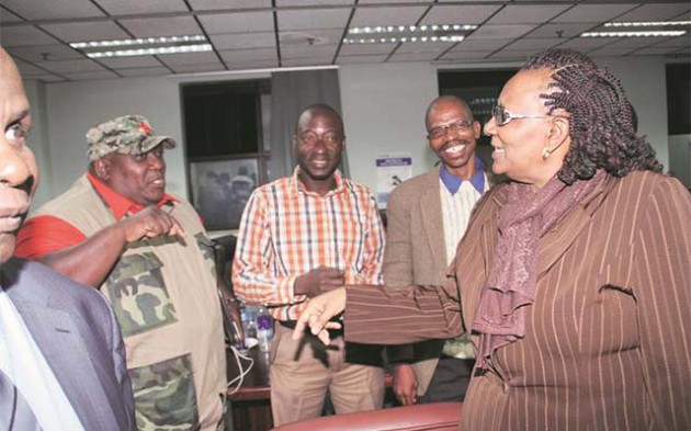 Public Service, Labour and Social Welfare Minister Prisca Mupfumira chats to Progressive Teachers Union of Zimbabwe secretary-general Mr Raymond Majongwe during yesterday’s meeting in Harare. Looking on are Mr Gibson Mashangu and Mr Dumisayi Muvishi. — (Picture by John Manzongo)
