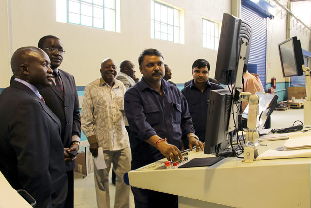 Secretary for Information and Publicity Mr George Charamba (second from left) being shown how the Zimpapers’ new US$2,2 million Orient X-Cel printing press works at Natprint yesterday alongside group chief executive Mr Justin Mutasa (third), chief operating officer Mr Pikirayi Deketeke (partially obscured on the right) and Harare Branch general manager Mr Samuel Bepe
