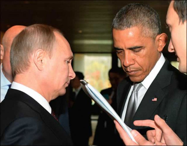 TETE-A-TETE . . . The Syrian crisis and the situation in Ukraine were on the agenda when presidents Vladimir Putin (left) and Barack Obama met on the sidelines of the Paris climate talks yesterday