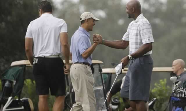 “GOOD SHOT MR PRESIDENT”, former NBA star Alonzo Mourning (above right) seems to be saying to Barack Obama during a game of golf while the rest of the nation was mourning the beheading of journalist James Foley