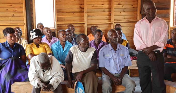 Oliver Chokera (standing) is accused of wizardly by the family members