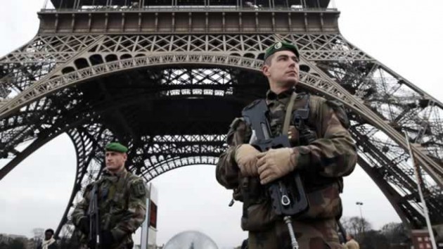 Heavily armed soldiers patrol the Eiffel Tower as France stepped up security following a series of attacks linked to ISIS last week