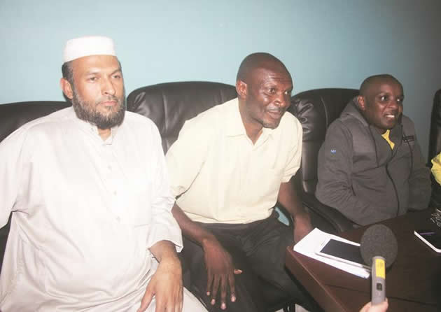 THREE IS COMPANY . . . Warriors coach Callisto Pasuwa (centre) is flanked by ZIFA board member Edzai Kasinauyo (right) and team manager Shariff Mussa as they faced the media together for the first time since the coach’s sacking and reinstatement by the association. — (Picture by Prudence Mpofu)