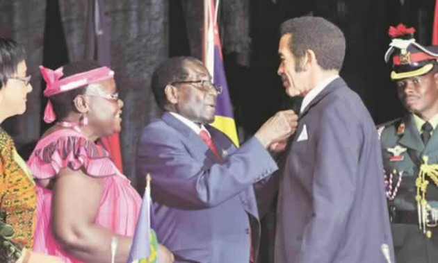 President Mugabe hands over the instruments of office to new Sadc chairman Lieutenant-General (Retired) Seretse Khama Ian Khama